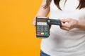 Cropped image of woman holding wireless modern bank payment terminal to process, acquire credit card payments Royalty Free Stock Photo