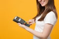 Cropped image of woman holding wireless modern bank payment terminal to process, acquire credit card payments Royalty Free Stock Photo