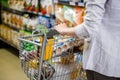 Cropped image of woman pushing trolley Royalty Free Stock Photo