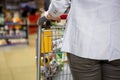 Cropped image of woman pushing trolley Royalty Free Stock Photo