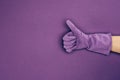 cropped image of woman showing thumb up in rubber protective glove