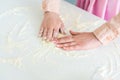 cropped image of woman spreading flour