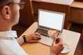 Cropped image of young attractive man sitting in cafe Royalty Free Stock Photo