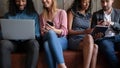 Cropped image young friendly multiracial people using different gadgets. Royalty Free Stock Photo