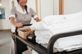 Cropped image of a young hotel maid bringing clean towels Royalty Free Stock Photo