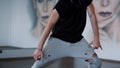 Unknown stylish dancer having workout in gym. Unrecognizable man dancing studio Royalty Free Stock Photo