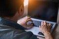 Cropped image of a young man working on his laptop Royalty Free Stock Photo