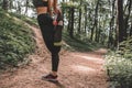 Sports female doing stretching legs before running outdoor Royalty Free Stock Photo