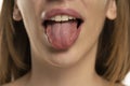 Cropped image of young woman showing tongue Royalty Free Stock Photo