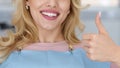 Cropped of lady showing beautiful smile and thumb up Royalty Free Stock Photo