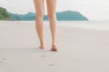 Cropped of the legs and feet. Women walking on the beach, freedom and lifestyle in summer, holiday and vacation ,selective focus Royalty Free Stock Photo