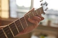 Cropped of man hand play riffs on guitar at home Royalty Free Stock Photo