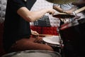 Cropped man playing cymbals and drums using drumsticks Royalty Free Stock Photo