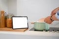 Cropped of man using digital tablet for recipes cooking in kitchen. Royalty Free Stock Photo