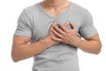 Cropped millennial european muscular male suffering from chest pain, presses hand to sore spot