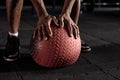 cropped Muscular athletic man exercise with medicine ball at health club or gym. Royalty Free Stock Photo