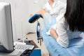 Cropped panorama of gynecologist examining a patient who is sitting in a gynecological chair. Female health concept. Royalty Free Stock Photo