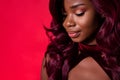 Cropped photo of attractive dark skin young woman empty space dream mood on red color background