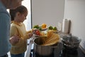 Bonding time in the kitchen for grandma and granddaughter