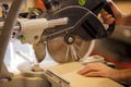 Cropped photo of carpenter using circular saw