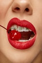 Cropped photo. Close up of woman in braces on teeth with red lips blowing smoke from mouth. Bad habits. No smoking or Royalty Free Stock Photo
