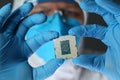 Close up of computer microchip in male hands