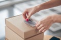 Woman employee preparing barcoded goods for shipping Royalty Free Stock Photo