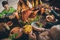 Cropped photo of full family relative gathering sit served dinner table share mom granny fetch food plate corn potato