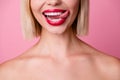 Cropped photo of good mood adorable girl naked shoulders tongue licking red lips isolated pink color background Royalty Free Stock Photo