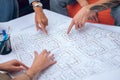 Team of draftspeople involved in work on a technical drawing Royalty Free Stock Photo