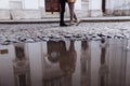 Cropped photo of Happy young stylish couple, enjoying their hugging in old road in city street with ancient building on the Royalty Free Stock Photo