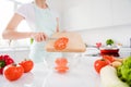 Cropped photo of housewife chef arms holding tomato knife slices add vegan salad ingredients enjoy morning cooking tasty Royalty Free Stock Photo