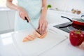 Cropped photo of housewife hands cutting chicken meat weekend morning cooking tasty dinner preparation family husband