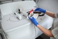 Woman biochemist standing with blood samples at a chemistry analyzer Royalty Free Stock Photo