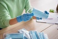 Cropped photo of lady hands latex gloves organize order facial flu medical masks sending customer prepare delivery anti