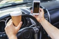 Man keeping cellphone and driving his car