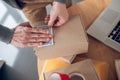 Experienced employee preparing barcoded goods for shipping Royalty Free Stock Photo