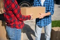 Cropped photo of man hands giving box to woman hands Royalty Free Stock Photo