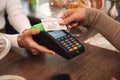 Cropped photo of mature woman paying credit card in cafe Royalty Free Stock Photo