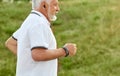 Cropped photo of old man listening to music while running . Royalty Free Stock Photo