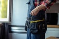 Skilled repairman preparing to fix a kitchen window