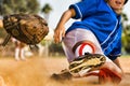 Cropped photo of softball player sliding into home plate