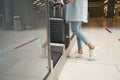 Air traveler using self-service luggage drop-off unit