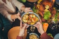 Cropped photo table arms share treat fried potato thanks giving dinner garnished turkey evening house living room