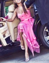 Cropped photo of teenage girl disembarking car with her prom date Royalty Free Stock Photo