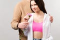 Cropped photo of two persons girlfriend and her boyfriend, lady receiving a floral present from her man on valentine day Royalty Free Stock Photo