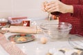 Cropped photo of woman coking and cracking egg Royalty Free Stock Photo