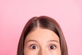 Cropped photo of young little girl child look see spy watch interested curious isolated over pink color background