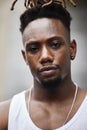 I run these streets. Cropped portrait of a handsome young male gangster standing outside on the street. Royalty Free Stock Photo