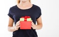 Cropped portrait of a smiling girl, woman holding stack of gift boxes isolated on white background. Holiday concept. Mock up, temp Royalty Free Stock Photo